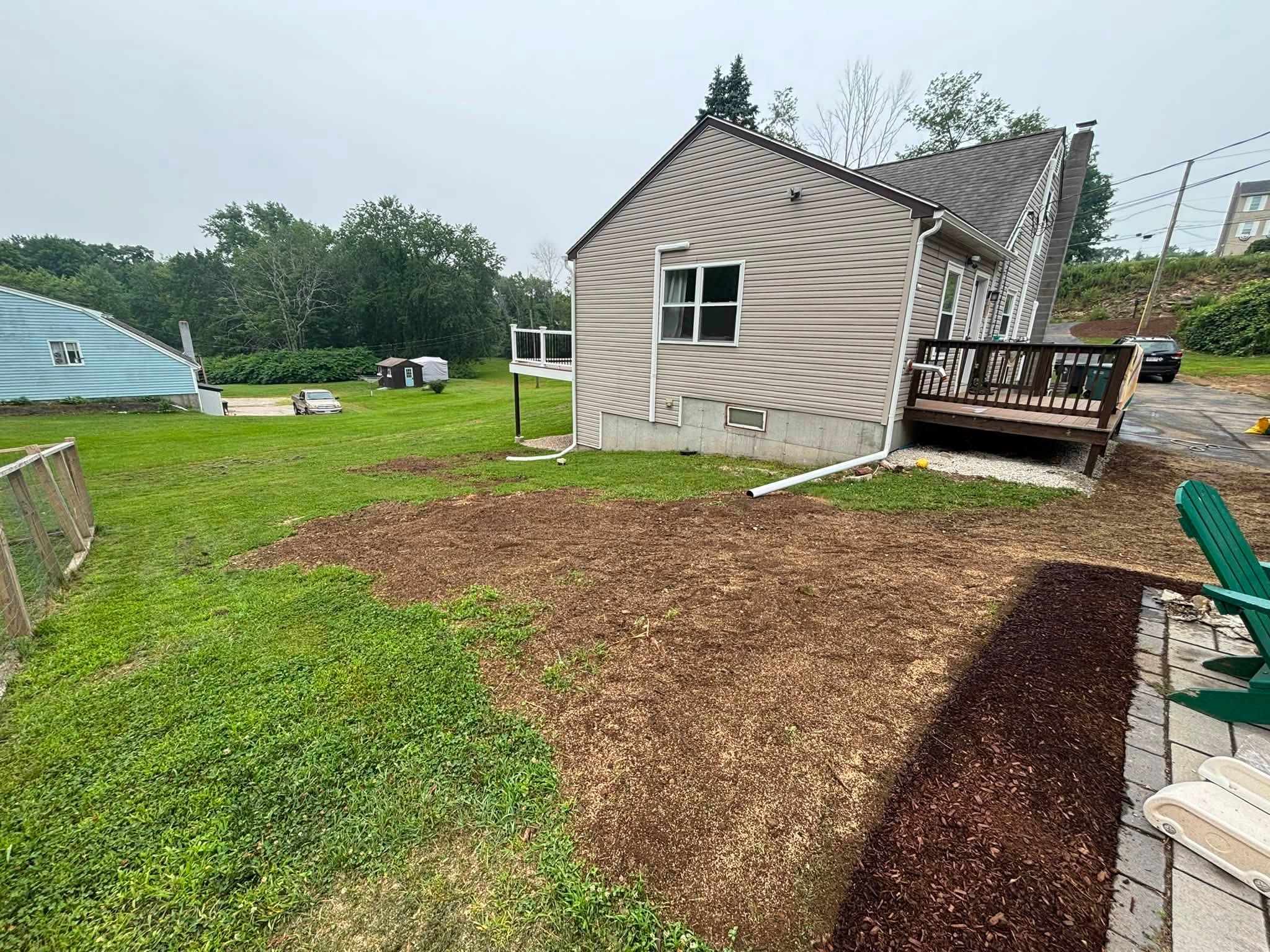 Drainage correction and stone walkway — full view after completion